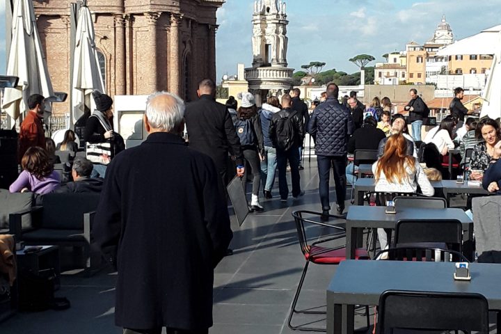 a group of people standing in front of a building