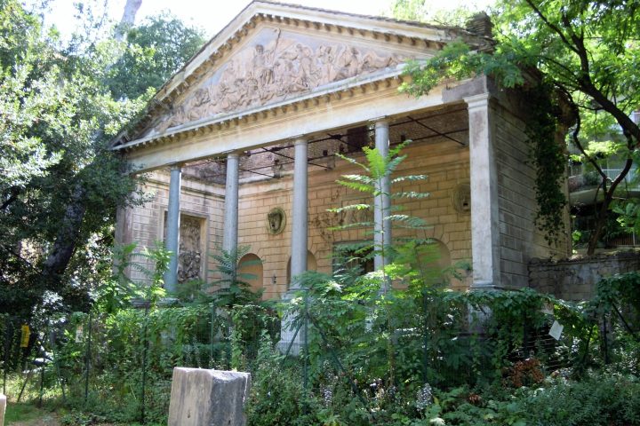a house with bushes in front of a building