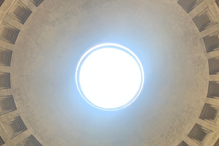 Circular dome interior with central oculus and coffered ceiling design.